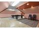 Finished attic space with pool tables, seating, and stylish lighting at 6001 Sweet Gum Run, Bartow, FL 33830