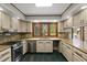 Kitchen featuring granite countertops, stainless steel appliances, and ample cabinet space at 6001 Sweet Gum Run, Bartow, FL 33830