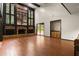Open-concept living room with fireplace and access to backyard at 6001 Sweet Gum Run, Bartow, FL 33830