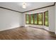 Bright living room boasts hardwood floors and a bay window providing plenty of natural light at 6001 Sweet Gum Run, Bartow, FL 33830