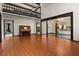 Spacious living room with hardwood floors, high ceilings, and a piano at 6001 Sweet Gum Run, Bartow, FL 33830