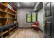Cozy office with built in bookshelves, diamond pane window, and decorative wallpaper at 6001 Sweet Gum Run, Bartow, FL 33830