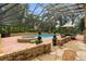 Screened-in pool featuring an in-ground pool, hot tub, and patio dining set at 6001 Sweet Gum Run, Bartow, FL 33830