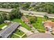 Aerial view of home with spacious lawn, surrounded by lush greenery in a suburban neighborhood at 6134 Christina E Dr, Lakeland, FL 33813
