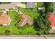 Aerial view of a home featuring a spacious yard and mature landscaping, nestled in a tranquil neighborhood at 6134 Christina E Dr, Lakeland, FL 33813