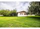 Cozy single-story home with an expansive green backyard and mature trees offering ample shade at 6134 Christina E Dr, Lakeland, FL 33813