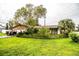 Inviting single-story home with a well-maintained lawn and beautiful mature shade trees at 6134 Christina E Dr, Lakeland, FL 33813