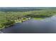 Aerial view of several properties along the lakefront at 6281 Halabrin Rd, Haines City, FL 33844