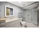 Bathroom featuring a shower, toilet, vanity, and a large mirror at 6281 Halabrin Rd, Haines City, FL 33844