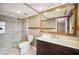 Bathroom featuring a shower, toilet, vanity, and a mirror with wood trim at 6281 Halabrin Rd, Haines City, FL 33844