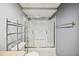 Bathroom featuring a shower-tub combo, toilet, and shelving rack at 6281 Halabrin Rd, Haines City, FL 33844