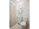 Compact bathroom featuring a white vanity, toilet, and a well-maintained louvered door closet at 6281 Halabrin Rd, Haines City, FL 33844