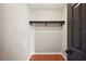 Walk-in closet featuring hardwood flooring, white walls and metal hanging rack at 6281 Halabrin Rd, Haines City, FL 33844