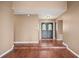 Open foyer with hardwood floors and double doors leading to the rest of the house at 6281 Halabrin Rd, Haines City, FL 33844