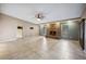 Large living room featuring tile flooring, ceiling fan and brick fireplace at 6281 Halabrin Rd, Haines City, FL 33844