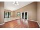 Bright living room with tile floors, chandelier, and sliding glass doors to a screened-in porch at 6281 Halabrin Rd, Haines City, FL 33844