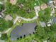 This aerial view showcases the neighborhood with a lovely pond and a gazebo available for residents to enjoy at 6342 Butternut Dr, Lakeland, FL 33813
