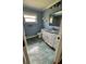Bathroom with blue walls, white vanity and a walk-in shower at 6342 Butternut Dr, Lakeland, FL 33813