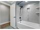 Bathroom featuring a stylish white tub with tile surround and modern fixtures at 6342 Butternut Dr, Lakeland, FL 33813