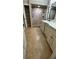 Bathroom featuring tile flooring, white vanity, marble countertop, and large shower at 6342 Butternut Dr, Lakeland, FL 33813