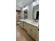 Bathroom featuring tile flooring, double sink vanity with marble countertop and large shower at 6342 Butternut Dr, Lakeland, FL 33813