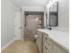Elegant bathroom with a stand-up shower, and granite countertops with dual sinks at 6342 Butternut Dr, Lakeland, FL 33813