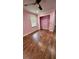A bedroom with wood flooring, closet and a window at 6342 Butternut Dr, Lakeland, FL 33813