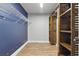 Walk-in closet features custom shelves and hanging rods for optimal storage space at 6342 Butternut Dr, Lakeland, FL 33813