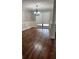 Traditional dining room showcasing hardwood floors, decorative chair rail, and elegant chandelier at 6342 Butternut Dr, Lakeland, FL 33813
