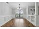 Bright dining room features beautiful hardwood floors and custom trim work, creating an elegant space at 6342 Butternut Dr, Lakeland, FL 33813