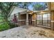 Charming home with a front-facing view of the walkway and green shrubbery at 6342 Butternut Dr, Lakeland, FL 33813