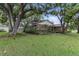 Single Gathering home with a well-maintained yard and beautiful mature trees at 6342 Butternut Dr, Lakeland, FL 33813