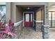 Inviting front entrance with a red door, stone accents, and a covered porch at 6342 Butternut Dr, Lakeland, FL 33813