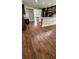 Spacious kitchen connecting to dining area with large island, stainless appliances, and hardwood floors at 6342 Butternut Dr, Lakeland, FL 33813