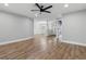 A spacious living room offers hardwood flooring and open access to the dining and front entry areas at 6342 Butternut Dr, Lakeland, FL 33813