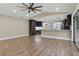 The open floor plan allows the kitchen to flow into the living room with hardwood floors throughout at 6342 Butternut Dr, Lakeland, FL 33813