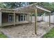 Spacious outdoor patio with a pergola and brick pavers, perfect for entertaining at 6342 Butternut Dr, Lakeland, FL 33813
