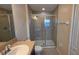Bathroom featuring tile flooring, shower with glass door, vanity, and toilet at 6415 Torrington Cir, Lakeland, FL 33811