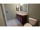 Bathroom featuring tiled floors, vanity with a sink, and a toilet at 6415 Torrington Cir, Lakeland, FL 33811