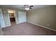 Bedroom with closet and a doorway view of the bathroom's vanity at 6415 Torrington Cir, Lakeland, FL 33811