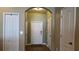 Welcoming entryway with light-colored walls, white doors, and wood-look flooring at 6415 Torrington Cir, Lakeland, FL 33811