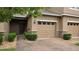 Close up of the front exterior highlighting the brick paver walkway, landscaping, and attached garage at 6415 Torrington Cir, Lakeland, FL 33811