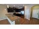 Kitchen with stainless steel appliances, granite countertops, and dark wood cabinets at 6415 Torrington Cir, Lakeland, FL 33811