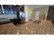 Well-lit kitchen featuring stainless steel appliances, granite countertops, and dark brown cabinets at 6415 Torrington Cir, Lakeland, FL 33811