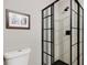 Modern bathroom featuring a frameless glass shower and toilet at 6819 Broken Arrow S Trl, Lakeland, FL 33813