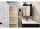 Bathroom featuring a modern vanity with a white countertop, dark wood accents, and unique decor at 6819 Broken Arrow S Trl, Lakeland, FL 33813