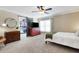 Bedroom featuring a sliding barn door to the closet and a ceiling fan at 6819 Broken Arrow S Trl, Lakeland, FL 33813