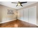 Bedroom featuring hardwood floors, recessed lighting, and a ceiling fan with closet storage at 6819 Broken Arrow S Trl, Lakeland, FL 33813