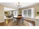 Elegant dining room with modern lighting and a round table with seating at 6819 Broken Arrow S Trl, Lakeland, FL 33813