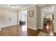 Bright foyer with hardwood flooring offering access to various living areas at 6819 Broken Arrow S Trl, Lakeland, FL 33813